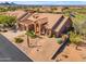 Lovely home featuring beautiful desert landscaping and barrel tile roof at 12605 E Kalil Dr, Scottsdale, AZ 85259