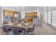 Open-concept kitchen with island, breakfast bar, stainless steel appliances, and adjacent dining area at 12605 E Kalil Dr, Scottsdale, AZ 85259