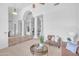 Elegant living area featuring high ceilings, classic columns, and open layout, enhancing spaciousness at 12605 E Kalil Dr, Scottsdale, AZ 85259