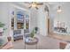 Bright living room featuring soaring ceilings, arched windows, and comfortable seating arrangements at 12605 E Kalil Dr, Scottsdale, AZ 85259