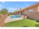 Backyard view of the sparkling pool and covered patio, ideal for entertaining and enjoying outdoor living at 12605 E Kalil Dr, Scottsdale, AZ 85259