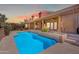Stunning backyard pool with covered patio and beautiful landscaping; perfect for outdoor living at 12605 E Kalil Dr, Scottsdale, AZ 85259