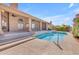 Backyard pool with desert landscaping, expansive patio and covered outdoor living space at 12605 E Kalil Dr, Scottsdale, AZ 85259