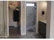 Bathroom featuring a closet and a tiled walk-in shower in a neutral color palette at 1333 N Higley Rd # 7, Mesa, AZ 85205