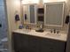 Bathroom boasts a double sink vanity, neutral color palette and walk-in shower at 1333 N Higley Rd # 7, Mesa, AZ 85205