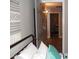 Bedroom featuring a bed with decorative pillows and a view into the hallway at 1333 N Higley Rd # 7, Mesa, AZ 85205
