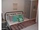 Stylish bedroom with decorative wall hangings and comfortable pillows at 1333 N Higley Rd # 7, Mesa, AZ 85205