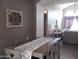 Cozy dining area adjacent to living space with table for six at 1333 N Higley Rd # 7, Mesa, AZ 85205