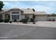 Charming single-story home features a two-car garage, desert landscaping, and a tile roof at 1333 N Higley Rd # 7, Mesa, AZ 85205