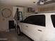 Garage view with vehicle, ladder, and storage at 1333 N Higley Rd # 7, Mesa, AZ 85205
