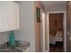 Hallway view featuring a marble countertop and wall art leading to a furnished bedroom at 1333 N Higley Rd # 7, Mesa, AZ 85205