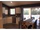 Stylish eat-in kitchen features stainless steel appliances, granite countertops, and pool view at 1333 N Higley Rd # 7, Mesa, AZ 85205