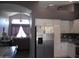 Open concept kitchen features stainless steel appliances and flows into the living area at 1333 N Higley Rd # 7, Mesa, AZ 85205