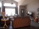 Inviting living room with high ceilings, large window, and comfortable seating at 1333 N Higley Rd # 7, Mesa, AZ 85205