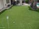 Artificial putting green with several holes, perfect for practicing your short game at 1333 N Higley Rd # 7, Mesa, AZ 85205
