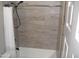 Shower featuring tiled walls and a modern showerhead and faucet at 1333 N Higley Rd # 7, Mesa, AZ 85205