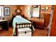 Traditional bedroom with wooden bed frame, dresser and decorative artwork at 1440 N Idaho Rd # 1022, Apache Junction, AZ 85119