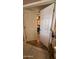 Open double doors revealing a peek into the bedroom, with decorative tile flooring at 1440 N Idaho Rd # 1022, Apache Junction, AZ 85119