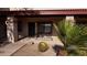 Inviting front porch with desert landscaping and seating area, perfect for relaxing at 1440 N Idaho Rd # 1022, Apache Junction, AZ 85119