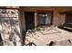 Charming front porch with seating area, offering a welcoming entrance at 1440 N Idaho Rd # 1022, Apache Junction, AZ 85119