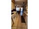 Galley kitchen offering views into the living room, stainless appliances, and tile flooring throughout at 1440 N Idaho Rd # 1022, Apache Junction, AZ 85119