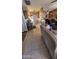 Open-concept living space with tiled floors and view to dining room and kitchen at 1440 N Idaho Rd # 1022, Apache Junction, AZ 85119