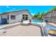 Entertain in this backyard, including a built-in grill, pool, and lovely landscaping at 1623 E Runion Dr, Phoenix, AZ 85024
