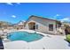 Inviting backyard with a sparkling pool, manicured landscaping, and a desert horizon at 1623 E Runion Dr, Phoenix, AZ 85024