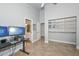 Bedroom showcasing high ceilings, tile flooring, and a doorway to an en-suite bathroom at 1623 E Runion Dr, Phoenix, AZ 85024