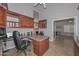 Functional home office with custom wooden cabinets, a built-in desk, and natural light at 1623 E Runion Dr, Phoenix, AZ 85024