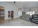 Spacious living room with an open floor plan, tile flooring, and comfortable seating at 1623 E Runion Dr, Phoenix, AZ 85024