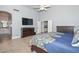 Well-lit main bedroom features tile flooring, lots of closet space, and en-suite bathroom access at 1623 E Runion Dr, Phoenix, AZ 85024