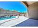 Covered patio and an outdoor kitchen area overlooking the pool and landscaped backyard at 1623 E Runion Dr, Phoenix, AZ 85024
