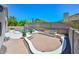 A beautiful backyard featuring a pool, built-in BBQ, and a red brick patio perfect for outdoor entertaining at 1623 E Runion Dr, Phoenix, AZ 85024