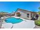 A breathtaking pool area featuring rock accents and a built-in BBQ, perfect for luxurious outdoor living at 1623 E Runion Dr, Phoenix, AZ 85024