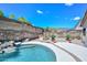 The backyard has a beautiful in-ground pool with small rock waterfall and desert landscaping at 1623 E Runion Dr, Phoenix, AZ 85024