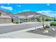 Street view of desert homes with tile roofs, low-maintenance landscaping, and mountain views in the distance at 1623 E Runion Dr, Phoenix, AZ 85024