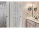 A well-lit bathroom features a tiled shower with a tub and a vanity with modern finishes at 1633 E Lakeside Dr # 156, Gilbert, AZ 85234