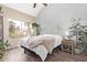 Bright bedroom with decorative floral wallpaper and luxury bedding, including a faux fur throw at 1633 E Lakeside Dr # 156, Gilbert, AZ 85234