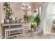 Dining room with writing desk, bench seating, and lots of houseplants at 1633 E Lakeside Dr # 156, Gilbert, AZ 85234