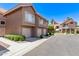 View of the front of a multi-unit dwelling with 3 garage spaces at 1633 E Lakeside Dr # 156, Gilbert, AZ 85234