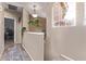 Bright hallway with a window, decorative plants, and stylish flooring at 1633 E Lakeside Dr # 156, Gilbert, AZ 85234