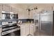 Close-up of a modern kitchen with stainless steel appliances and custom backsplash at 1633 E Lakeside Dr # 156, Gilbert, AZ 85234