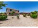 Two story home with a covered patio and gravel landscaping to minimize water usage at 16450 W Lilac St, Goodyear, AZ 85338