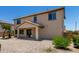 Two story house featuring a covered patio and minimal landscaping to minimize upkeep at 16450 W Lilac St, Goodyear, AZ 85338