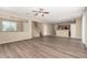 Spacious living room features an open floor plan and modern wood flooring at 16450 W Lilac St, Goodyear, AZ 85338