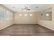Bright living room features multiple windows and neutral walls at 16450 W Lilac St, Goodyear, AZ 85338