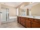 Spacious main bathroom with double vanity and glass shower at 16450 W Lilac St, Goodyear, AZ 85338