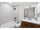 Classic bathroom with modern fixtures, featuring a shower-tub combo and a stylish vanity at 1713 W Royal Palm Rd, Phoenix, AZ 85021