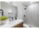 Modern bathroom featuring a sleek vanity with black fixtures and a walk-in shower at 1713 W Royal Palm Rd, Phoenix, AZ 85021